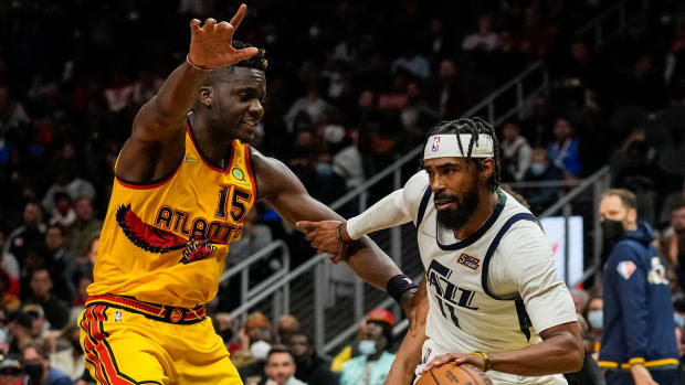 Hawks center Clint Capela defends Jazz guard Mike Conley.